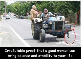 Підпис англійською: "Невідпорний доказ того, що добра жінка може принести у ваше життя -- стабільнісь та рівновагу"