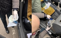 Прокуратура з Рівненщини каже, що накрила на хабарі в $500 поліціянта з Житомирщини (ФОТО)